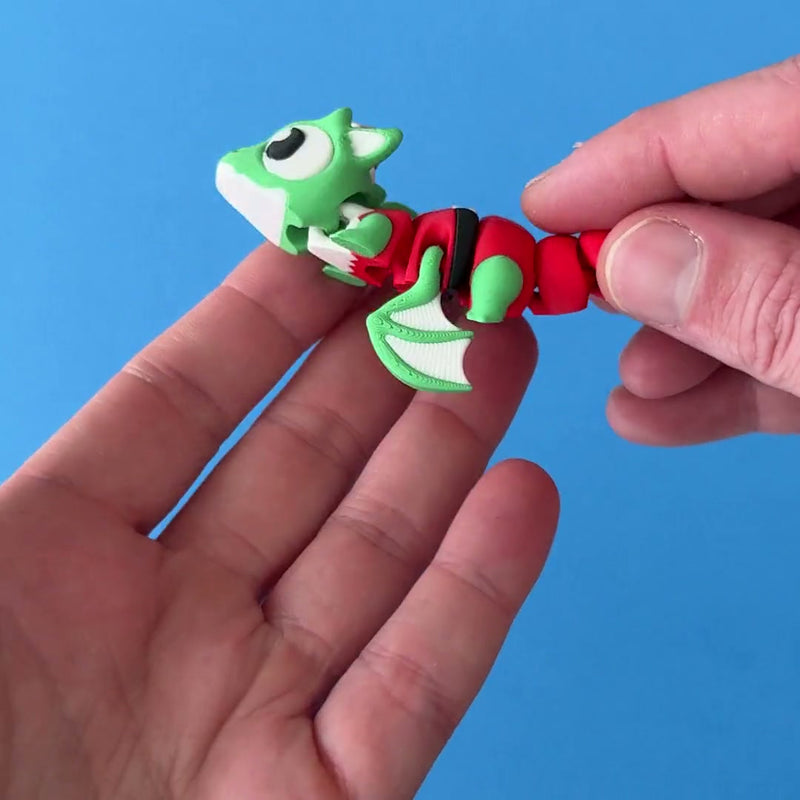 Tinsel the Elf Dragon 3D printed fidget wiggling in hand