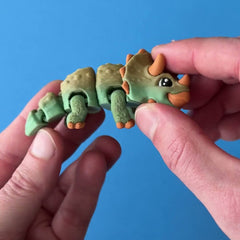 Tippa the Triceratops 3D printed fidget wiggling in hand