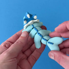 Vaponk the Fanchonk Dragon 3D printed fidget wiggling in hand