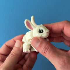 Willow the White Rabbit 3D printed fidget wiggling in hand