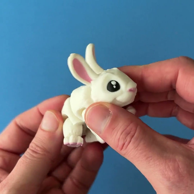 Willow the White Rabbit 3D printed fidget wiggling in hand