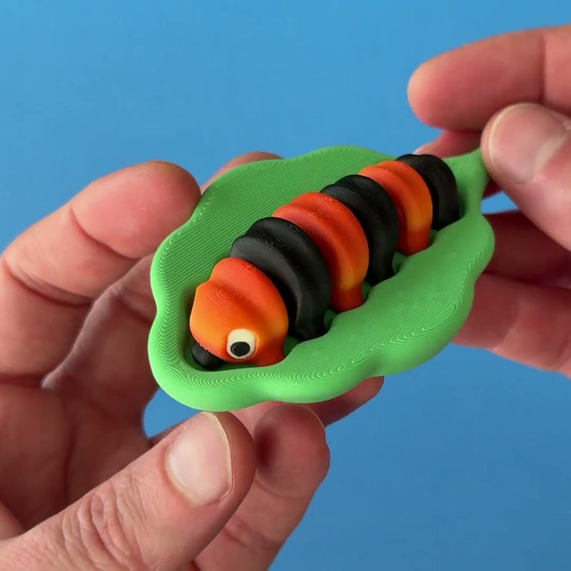 Ziggy the Caterpillar 3D printed fidget wiggling in hand