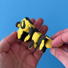 Zubb the Bee Dragon 3D printed fidget wiggling in hand