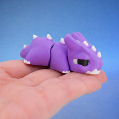 Close-up of the purple spiky chonk dragon's horned face