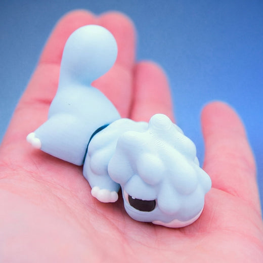 Close-up of the pale blue chonk dragon fidget toy's face