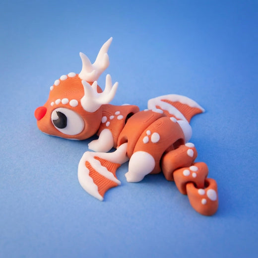 Brown reindeer dragon fidget toy seen from above, showing its white-dotted markings and fins