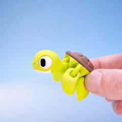 Close-up of Shelly the sea turtle fidget toy's face and flippers