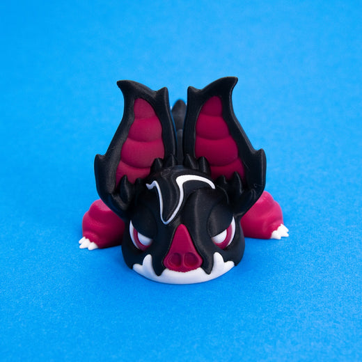 Sipp face-on with tall red-lined bat ears and a sleepy scowl, front view