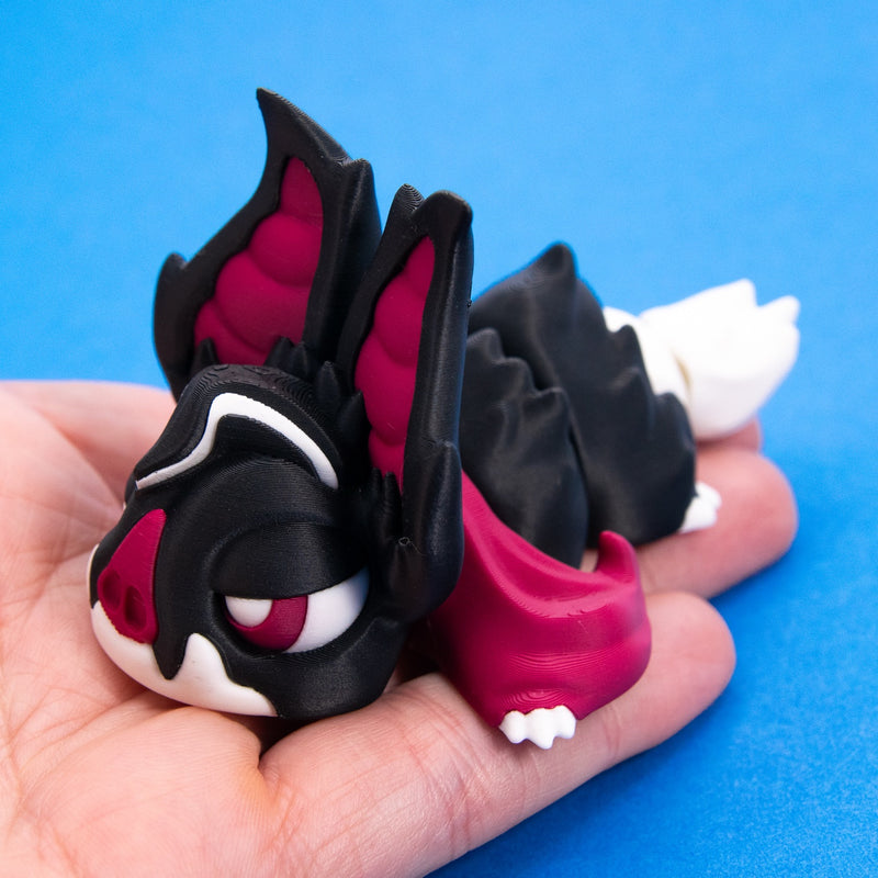 Sipp the Vampire Bat Beastchonk resting in an open palm