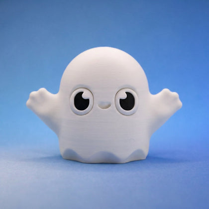 White ghost bean fidget figurine with round eyes and a cheeky grin, arms raised