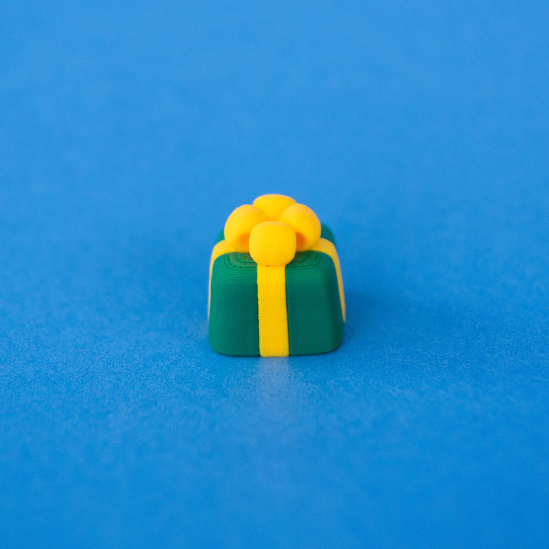 Sprig the green present Christmas keycap, angled view