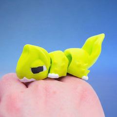Close-up of the yellow-green chonk dragon fidget toy's face