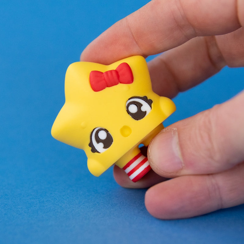 Stella the Christmas Star Clicker in hand on a blue background