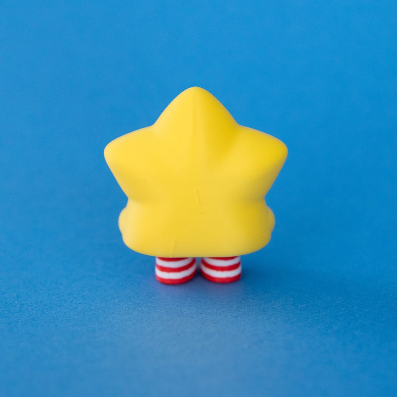 Stella the Christmas Star Clicker rear view on a blue background