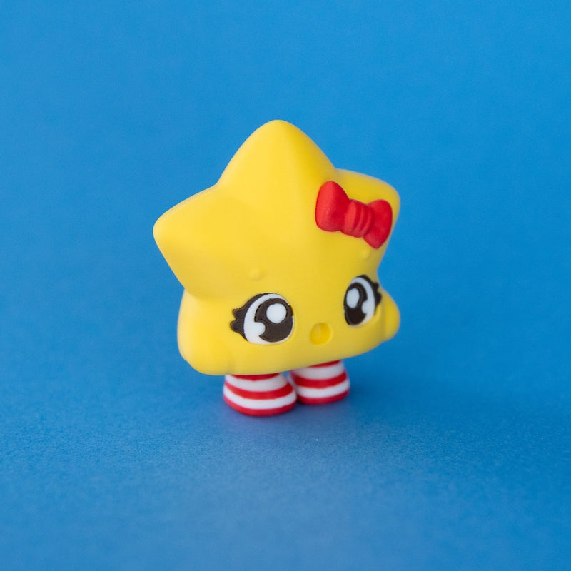 Stella the Christmas Star Clicker three quarter view on a blue background