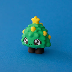 Tannen the Christmas Tree Clicker front view on a blue background