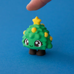 Tannen the Christmas Tree Clicker released on a blue background