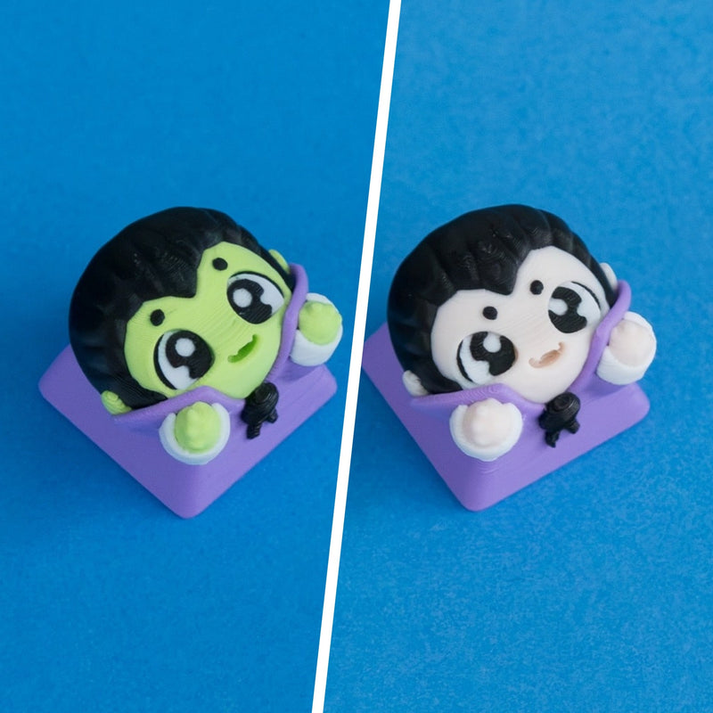 Fangy before-dinner and after-dinner vampire keycaps shown side by side.