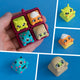 Zibby, Kernie, Spotto and Wrappy keycaps alongside the plum four-slot clicker base.