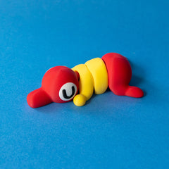 Trek the Hiker Fanchonk in red and yellow, asleep, side view