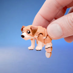 Close-up of the brown dog fidget toy's face and white paws