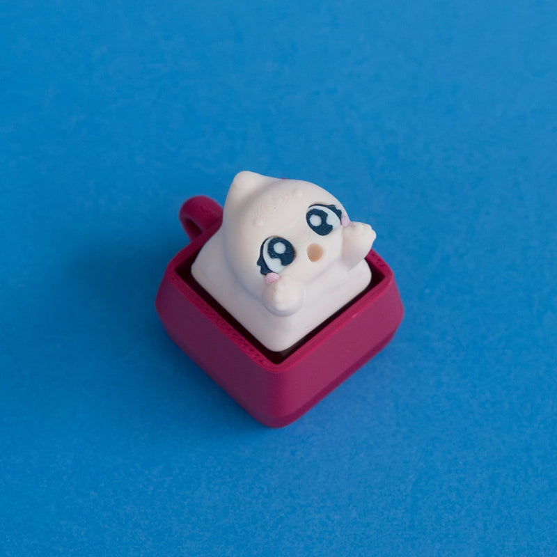 Wispy the beige ghost keycap on plum clicker base.