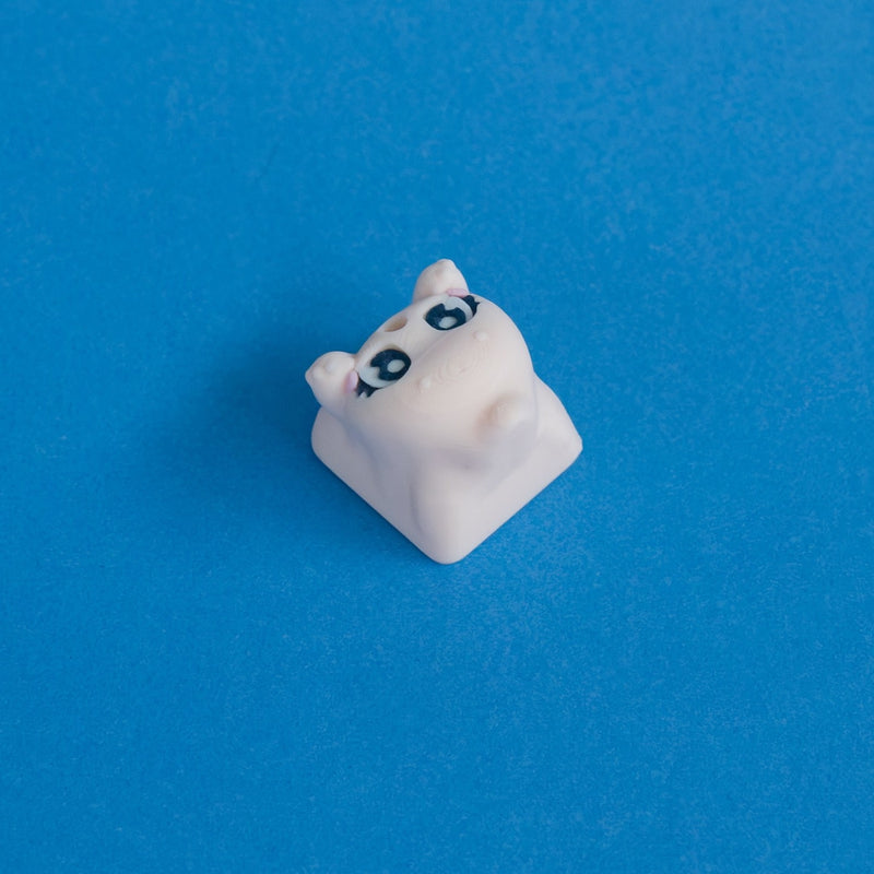 Wispy the beige ghost keycap three quarter view.