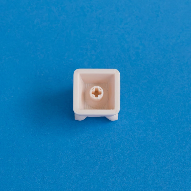 Wispy the beige ghost keycap underside MX stem.