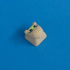 Wrappy the mummy keycap three quarter view.