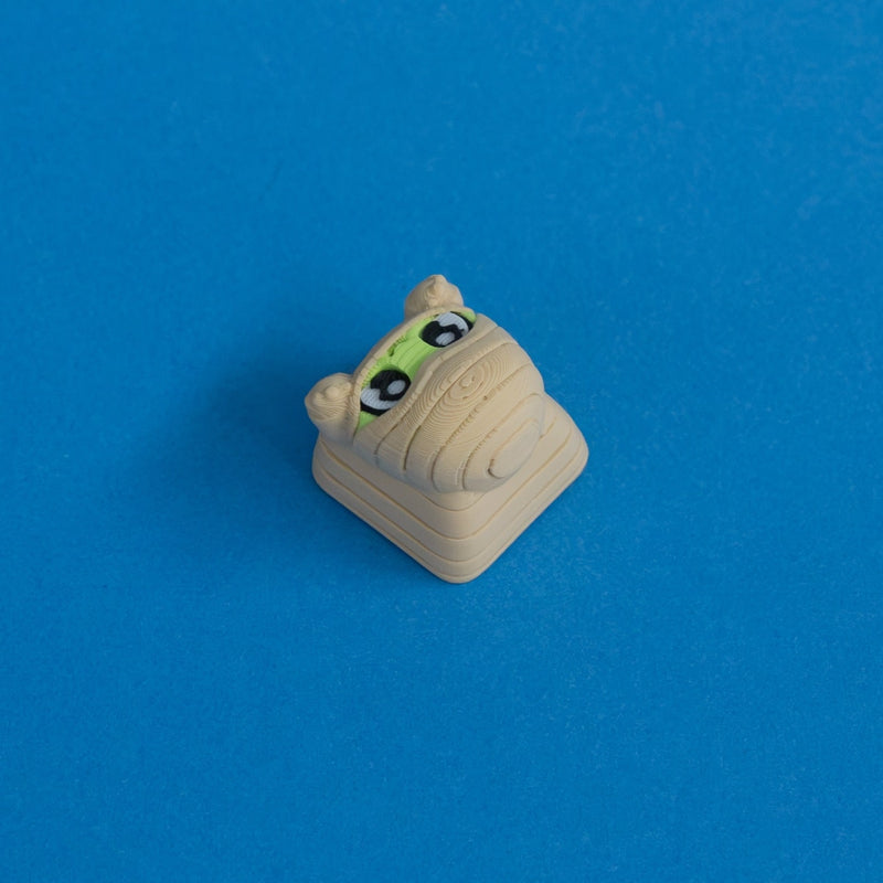 Wrappy the mummy keycap three quarter view.