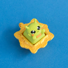 Zibby the bright green alien keycap in gold frame clicker.