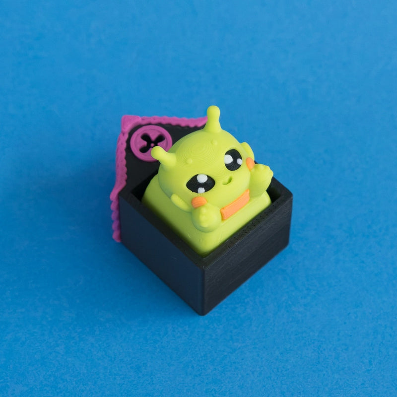 Zibby the bright green alien keycap in Hollow Lane single clicker house.